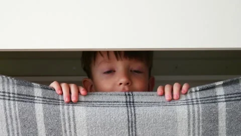 Boy Peeking Stock Video Footage | Royalty Free Boy Peeking Videos | Pond5