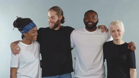 Close up face happy Multi-ethnic people look at camera smiling hugging on grey Video stock 133643268