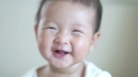 Close up face of happy smile Asian adorable baby girl , positive emotion of b Stock Footage