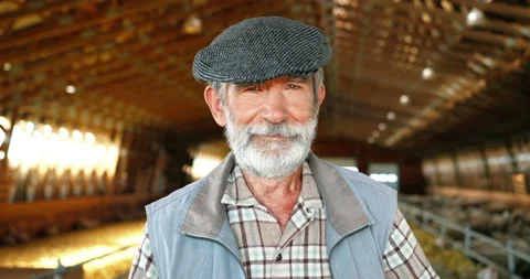 Close up of face of happy smiled handsome Caucasian man farmer in cap standing Stock Footage 138233346