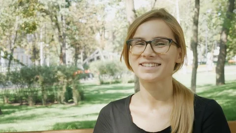 Close up face of a happy young caucasian woman on the nature looking at camer Stock-Footage 114179853