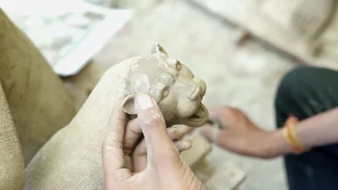 Close up face of a Lion in clay idol of Goddess Devi Durga Stock Footage 229727492