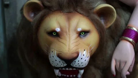 Close up face of a Lion in clay idol of Goddess Devi Durga Stock Footage 229728185