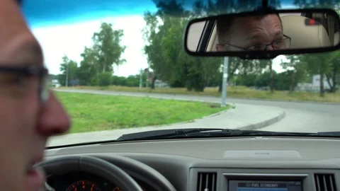 Close up on face of man as he drives his car Stock Footage 94047336