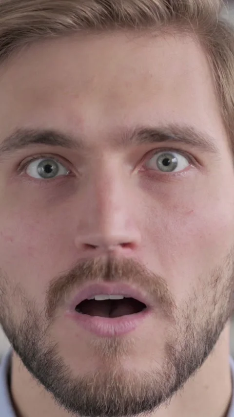 Close up of Face of Man with Shocked Expression, Vertical Video Stock Footage 339577604