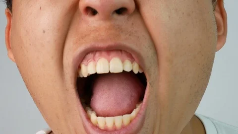 Close up face of men in white t-shirt angry and shout damn with what he saw. Stock Footage 129997582