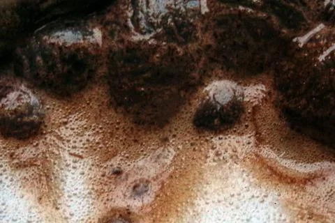 Close-up of face with mud mask and bubbles Stock Photos