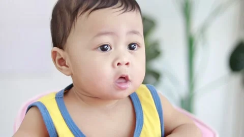 Close-up of the face of a nine-month-old male baby boy. Video stock 226121698