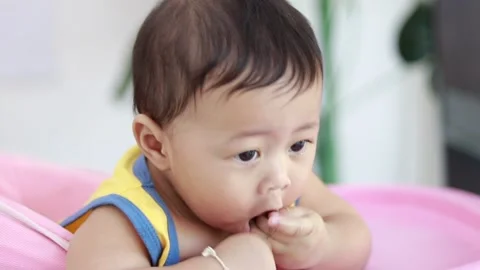 Close-up of the face of a nine-month-old male baby boy. Video stock 226121700