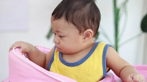 Close-up of the face of a nine-month-old male baby boy. Video stock 226121702