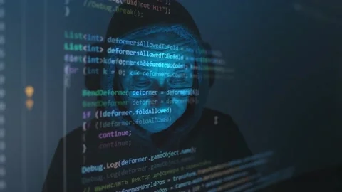 Close-up face of old man wearing glasses, experienced programmer, hooded hack Stock Footage 170897398
