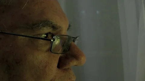 Close-up of the face of an old man who looks Stock Footage 98497162