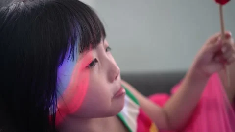 Close up the face of rainbow light on Chines girl. Stock Footage 225853312