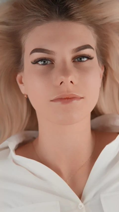 This close-up face reflects natural attractiveness and charm, accentuated by Stock Footage 283204497