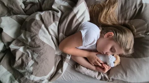 Close-up face of a sleeping child baby on its side. Healthy baby's sleep. Stock Footage 296340890