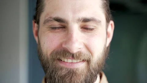 Close up face of smiling bearded businessman standing at workplace in moder Stock Footage 321130342