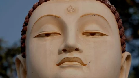 Close-up of the face of a statue of god Stock Footage 128531946