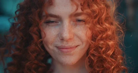 Close up face sunshine young smiling woman with red curly hair look at camera Stock Footage 200957753