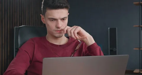 Close up Face of Tired man is working hard on his Laptop, looks Upset, Stressed Stock Footage 127326084