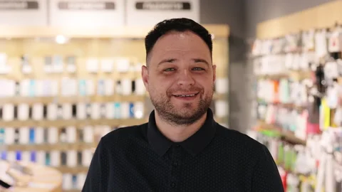 Close up face view business portrait. Smiling caucasian millennial seller man in Stock Footage 194427892
