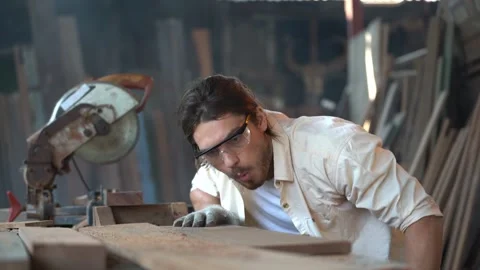 Close up face of worker man using sandpaper to rub timber wood. Stock Footage 154961693