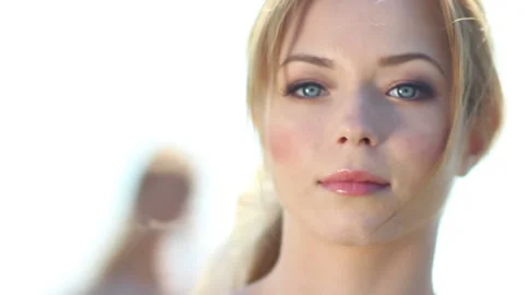 Close-up face of a young blonde with blue eyes 動画素材 131436265