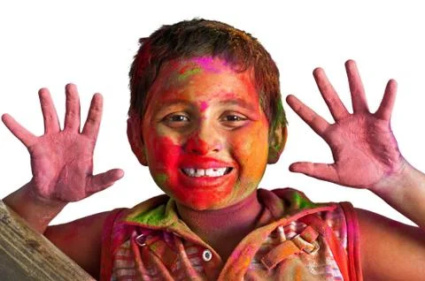 Close up face of young boy playing Holi, smiling with colors on Stock Photos