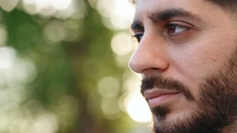 Close up face young caucasian bearded man portrait looking away serious Stock Footage 200206696