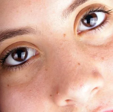 Close up of the face of a young lady Stock Photos