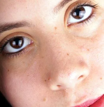 Close up of the face of a young lady Stock Photos