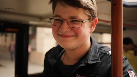 Close up face young man with glasses look at camera smile feel happy stand in Stock Footage 98148521