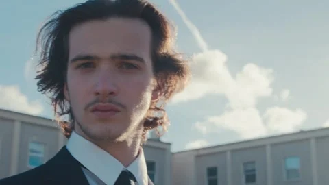 Close-up of the face of a young man in a stylish classic business suit 库存影片 330669073