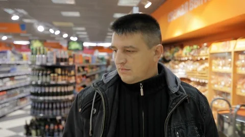 Close up face young man walking in supermarket Stock Footage 100597614