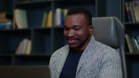 Close-up of the face of young man working online in an office or home, a young Видео 263630448