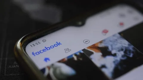 Close-up facebook social network scrolling on the phone. 스톡 동영상 196737582