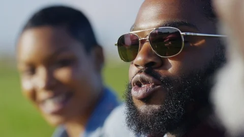 Close up of faces of people during a conversation outdoors Video stock 108694941