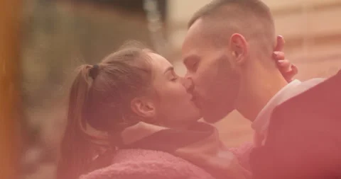 Close-up of the faces of a young couple in love kissing Stock Footage 247185011