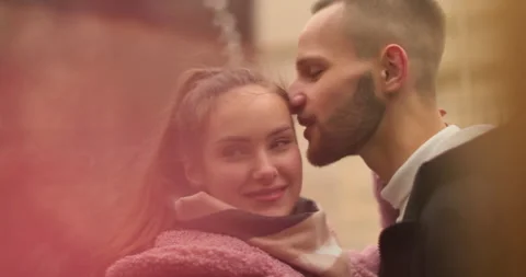 Close-up of the faces of a young couple in love kissing Stock Footage 247185033