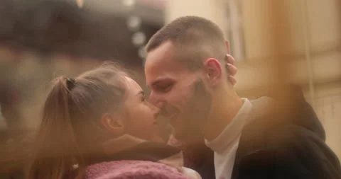 Close-up of the faces of a young couple in love kissing Stock Footage 247185689