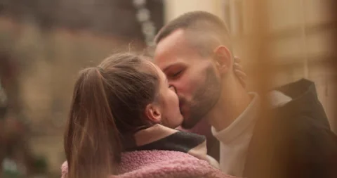 Close-up of the faces of a young couple in love kissing Stock Footage 247185784