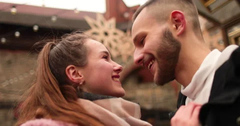 Close-up of the faces of a young couple in love kissing Stock Footage 247185812