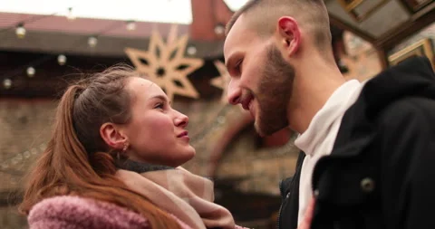 Close-up of the faces of a young couple in love kissing Stock Footage 247185889