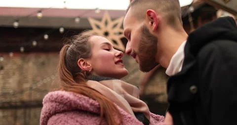 Close-up of the faces of a young couple in love kissing Stock Footage 247186005