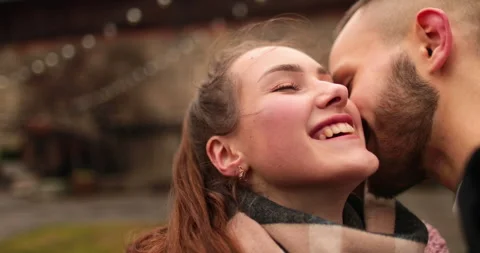 Close-up of the faces of a young couple in love kissing Stock Footage 247186331