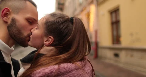 Close-up of the faces of a young couple in love kissing Stock Footage 247187139
