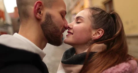 Close-up of the faces of a young couple in love kissing Stock Footage 247187230