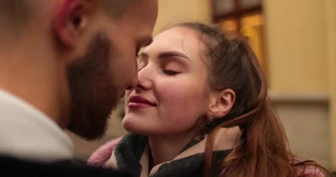 Close-up of the faces of a young couple in love kissing Stock Footage 247187289