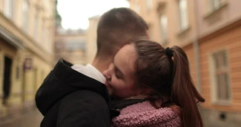 Close-up of the faces of a young couple in love kissing Stock Footage 247187640
