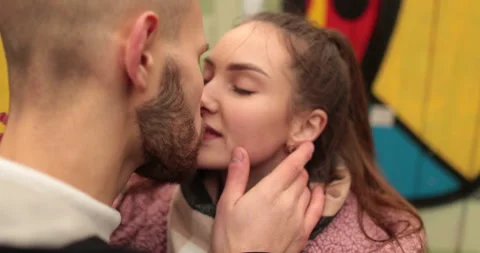 Close-up of the faces of a young couple in love kissing Stock Footage 247187928