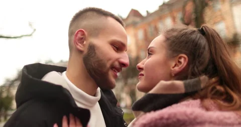 Close-up of the faces of a young couple in love kissing Stock Footage 247189269